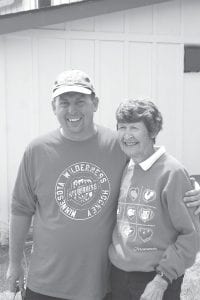 Pastor Mark Kohl of Cloquet’s Our Redeemer Church and Geogianna Messenbring share a laugh during a break in the work at the Life in Christ Lutheran Church.