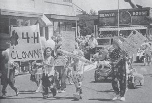 The short, but always entertaining Fourth of July parade in Grand Marais, featured these young marchers from the Cook County 4-H clubs. The West End was also full of holiday revelers and festivities in 1998 including the annual parade, cannon firing, picnics, food, and of course—fireworks!