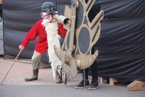 Above: Using a spyglass, Joseph Mayhew looks for the light that can guide him home during the Solstice Puppet Pageant. Left: Gamepalaja performed the lively music for the puppet pageant.