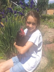 Olya Wright with her pet chicken Peck-a-ny Henderson. Olya leads the Nordic Nature Group, which is made up of Cook County youth committed to helping the environment.